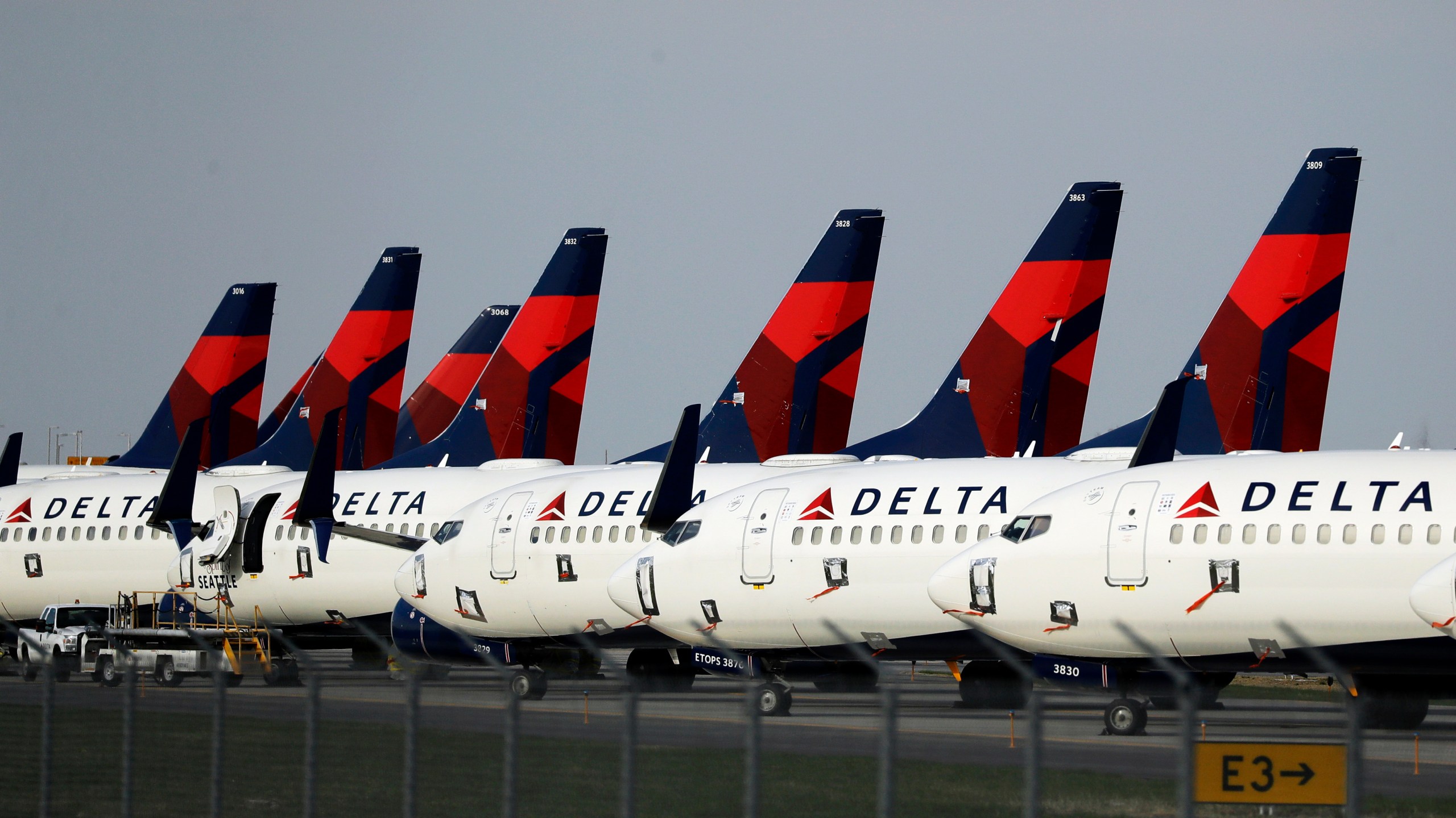 FILE - In this April 1, 2020, file photo, several dozen Delta Air Lines jets are parked at Kansas City International Airport in Kansas City, Mo. Delta is backtracking slightly on changes it previously announced in its frequent-flyer program, but it still plans to reshape SkyMiles to favor big spenders over customers who take the most flights. Delta outlined the revisions in an email from CEO Ed Bastian to SkyMiles members on Wednesday, Oct. 18, 2023. (AP Photo/Charlie Riedel, File)