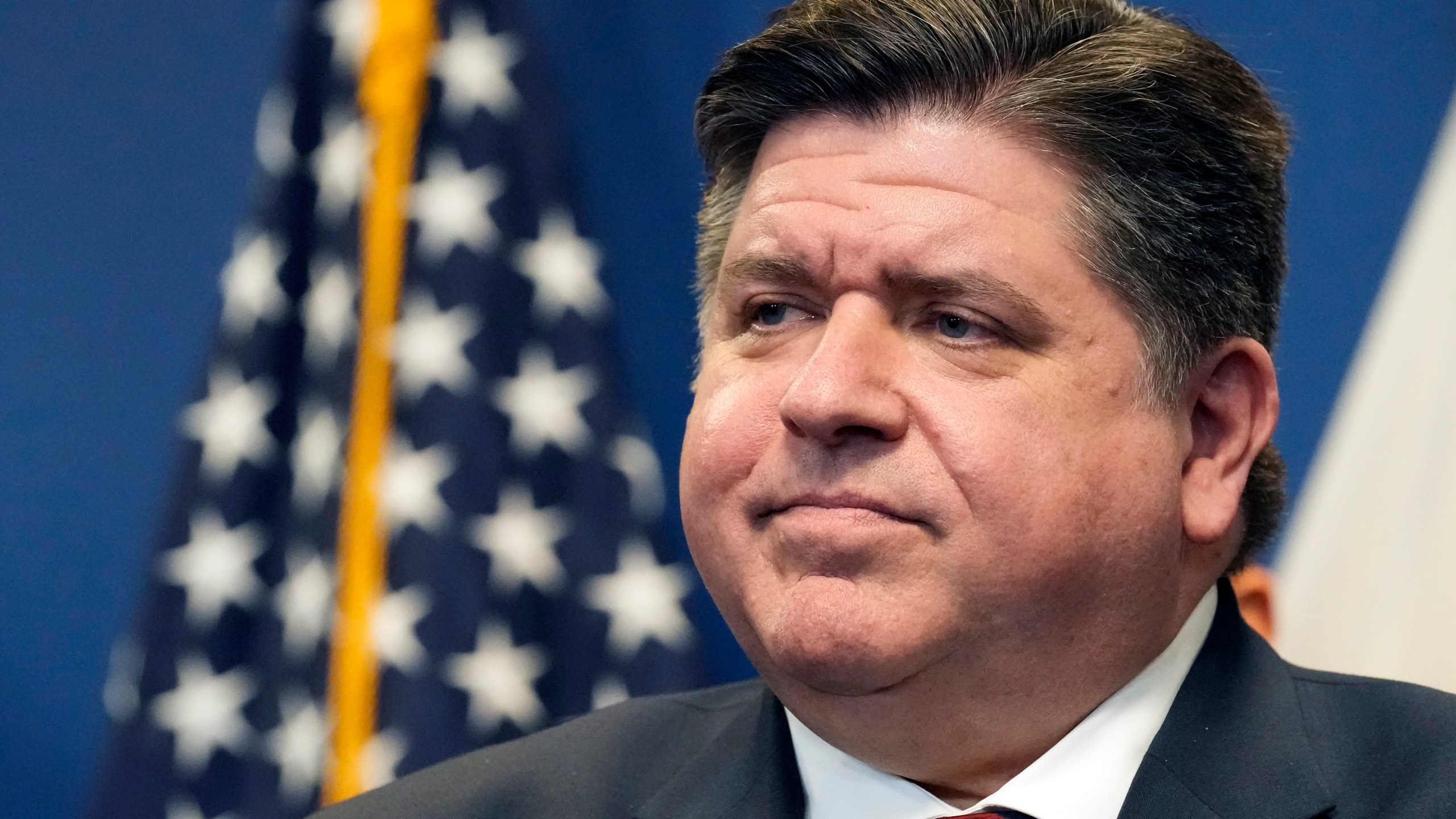 FILE - Illinois Gov. J.B. Pritzker looks out over the crowd during the Illinois Paid Leave bill signing ceremony Monday, March 13, 2023, in Chicago. Pritzker is taking his advocacy for abortion rights nationwide, forming a political organization to fund like-minded efforts outside Illinois, a state that legalized abortion by statute even before the Supreme Court invalidated the right to seek one. (AP Photo/Charles Rex Arbogast)