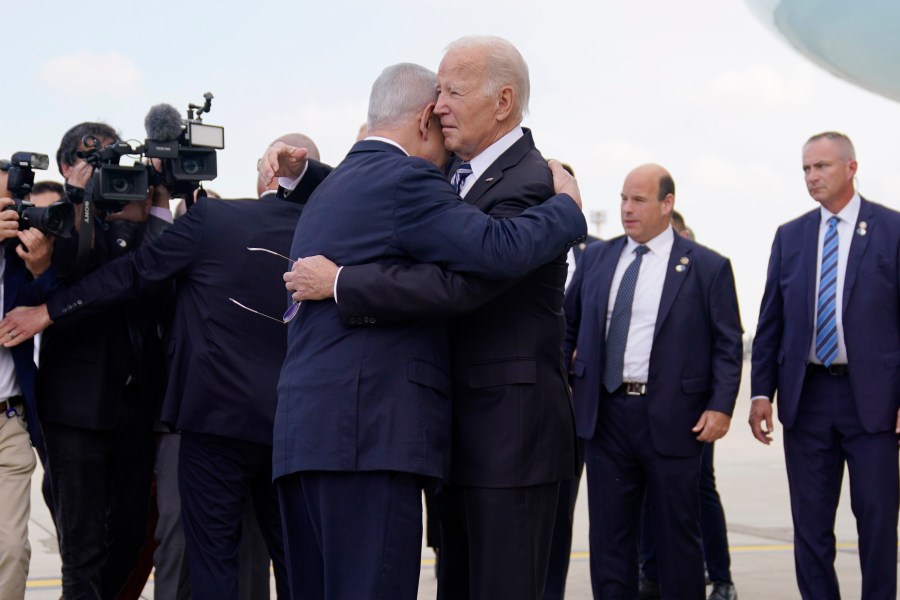 President Joe Biden is greeted by Israeli Prime Minister Benjamin Netanyahu after arriving at Ben Gurion International Airport, Wednesday, Oct. 18, 2023, in Tel Aviv. (AP Photo/Evan Vucci)