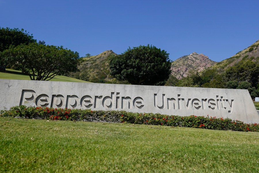 The entrance sign to Pepperdine University is seen Wednesday, Oct. 18, 2023, in Malibu, Calif. The Los Angeles County Fire Department says four people died after a multicar crash on the Pacific Coast Highway Tuesday at about 8:30 p.m. Four people were pronounced dead at the scene. Pepperdine University says there "is reason to believe" the four killed were students from its Seaver College of Liberal Arts. The cause of the crash is under investigation. (AP Photo/Ryan Sun)