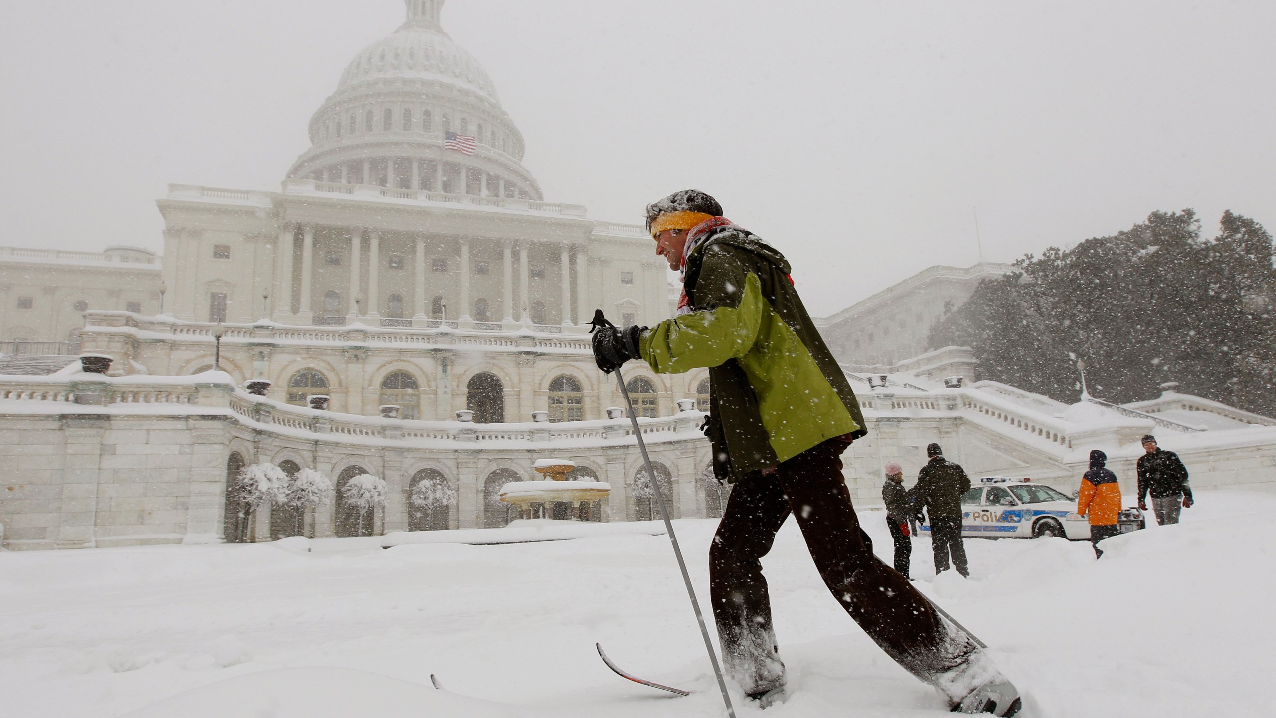 FILE - Travis Grout uses his cross country snow skis to get around the West Front of the Capitol in Washington, Feb. 6, 2010. Federal forecasters are predicting on Thursday, Oct. 19, 2023, less snow in general for the United States winter, but they said big snow events are possible like Washington’s paralyzing Snowmageddon storm that dumped more than 2 feet on the capital region during an El Nino. (AP Photo/Alex Brandon, File)