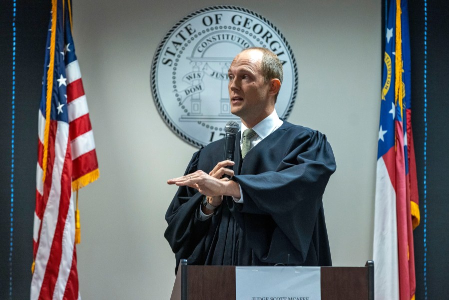 Fulton Superior Court Judge Scott McAfee addresses potential jurors during jury selection for lawyer Kenneth Chesebro's trial, Friday, Oct. 20, 2023, at the Fulton County Courthouse in Atlanta. Jury selection began Friday for Chesebro, the first defendant to go to trial in the Georgia case that accuses former President Donald Trump and others of illegally scheming to overturn the 2020 election in the state. (Alyssa Pointer/Pool Photo via AP)