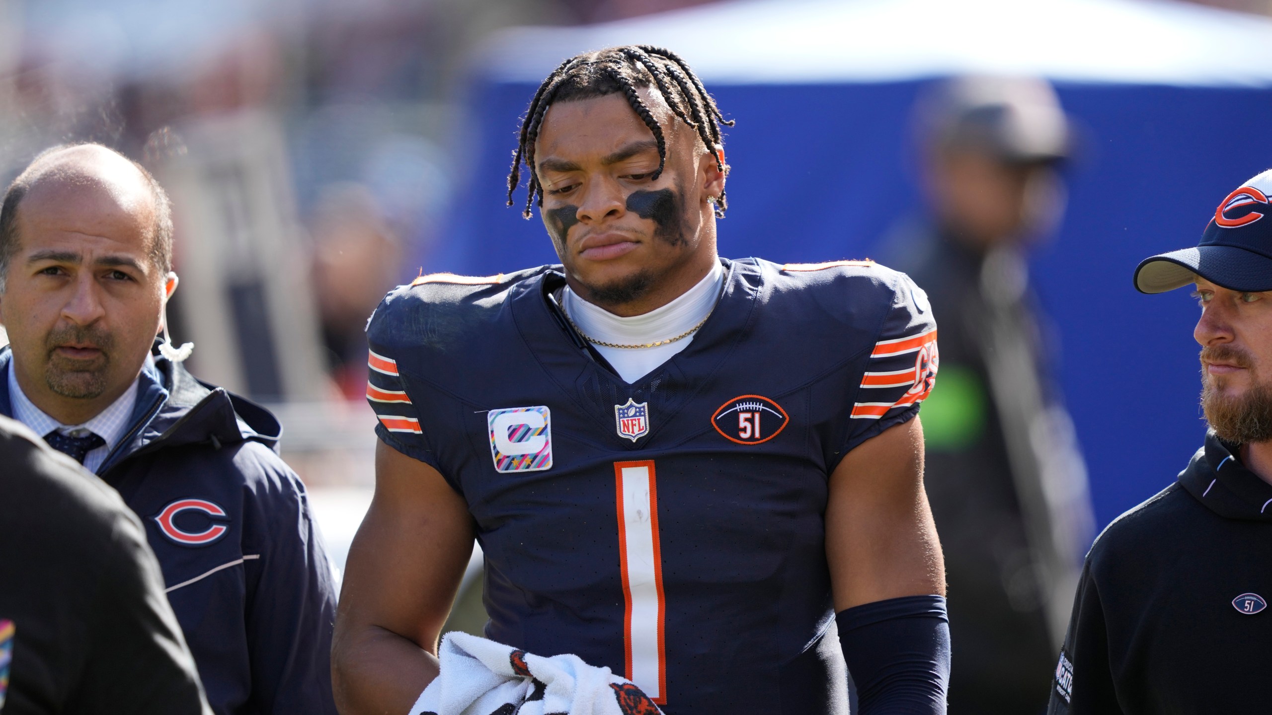 Chicago Bears quarterback Justin Fields walks to the locker room after being sacked during the second half of an NFL football game against the Minnesota Vikings, Sunday, Oct. 15, 2023, in Chicago. (AP Photo/Charles Rex Arbogast)