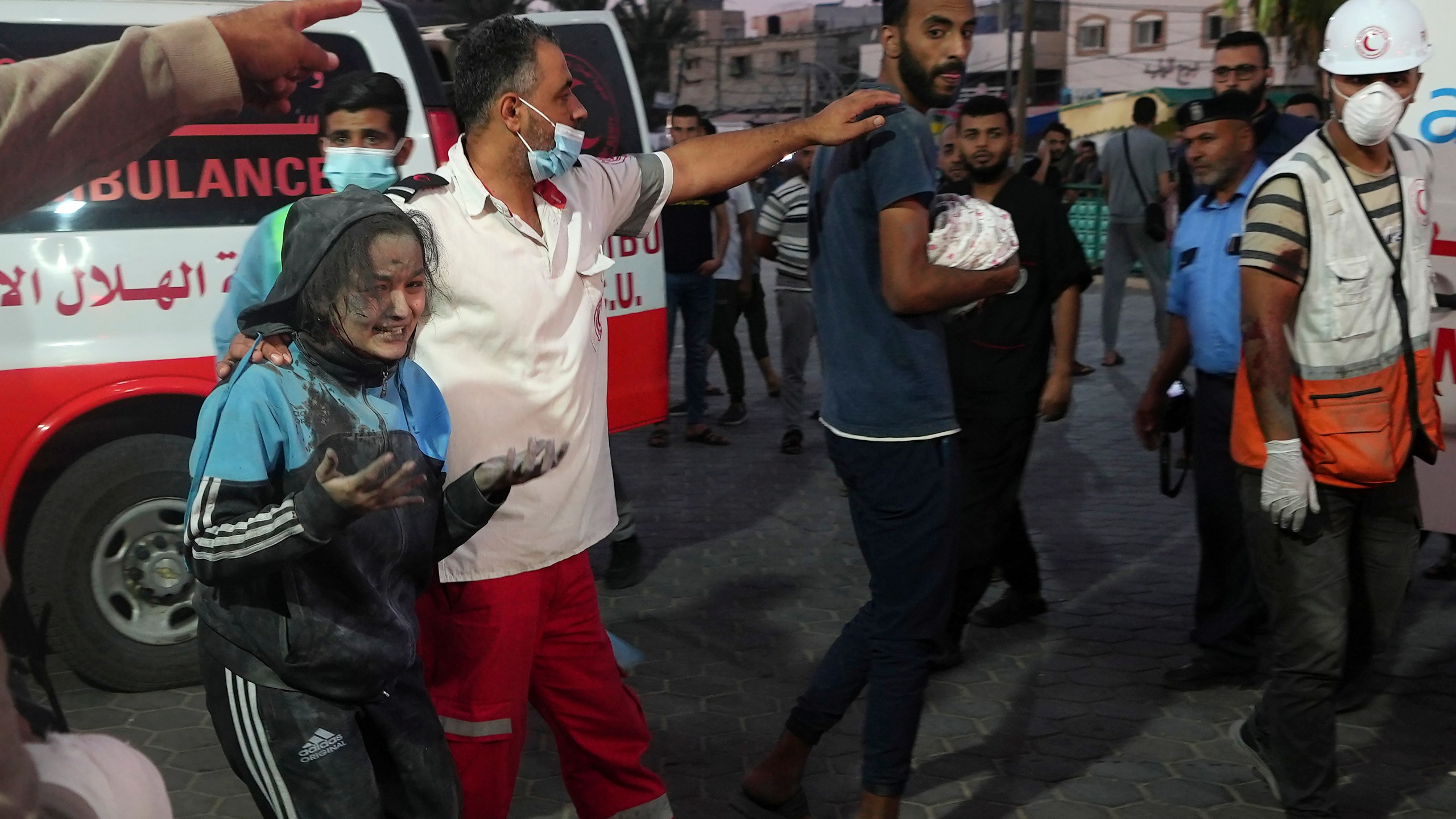 A man brings his baby killed in Israeli bombardment to Al Asa Hospital in Deir el-Balah City, Gaza Strip, Saturday, Oct. 21, 2023. (AP Photo/Adel Hana)