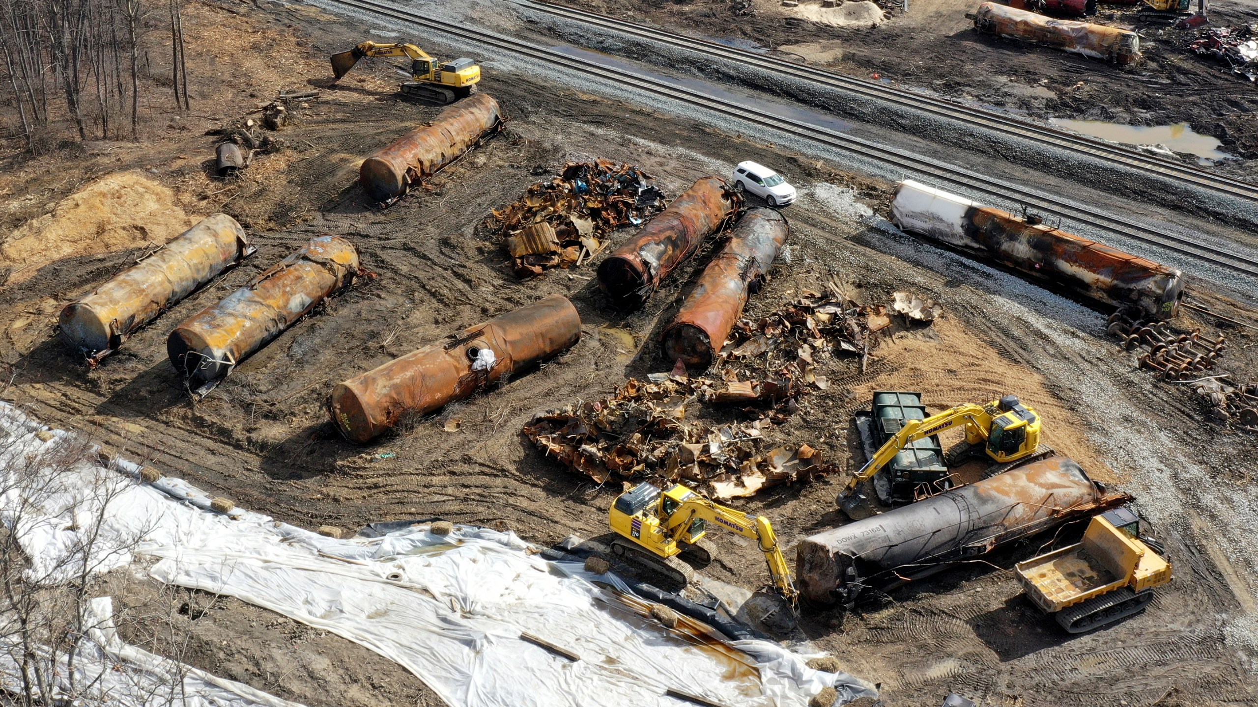 FILE - Cleanup continues, Feb. 24, 2023, at the site of a Norfolk Southern freight train derailment that happened on Feb. 3 in East Palestine, Ohio. The costs related to the East Palestine derailment continue to grow to reach $966 million for Norfolk Southern, but the railroad's service is improving and its insurance companies have started to pay their share of the cost of the crash in eastern Ohio early this year. (AP Photo/Matt Freed, File)