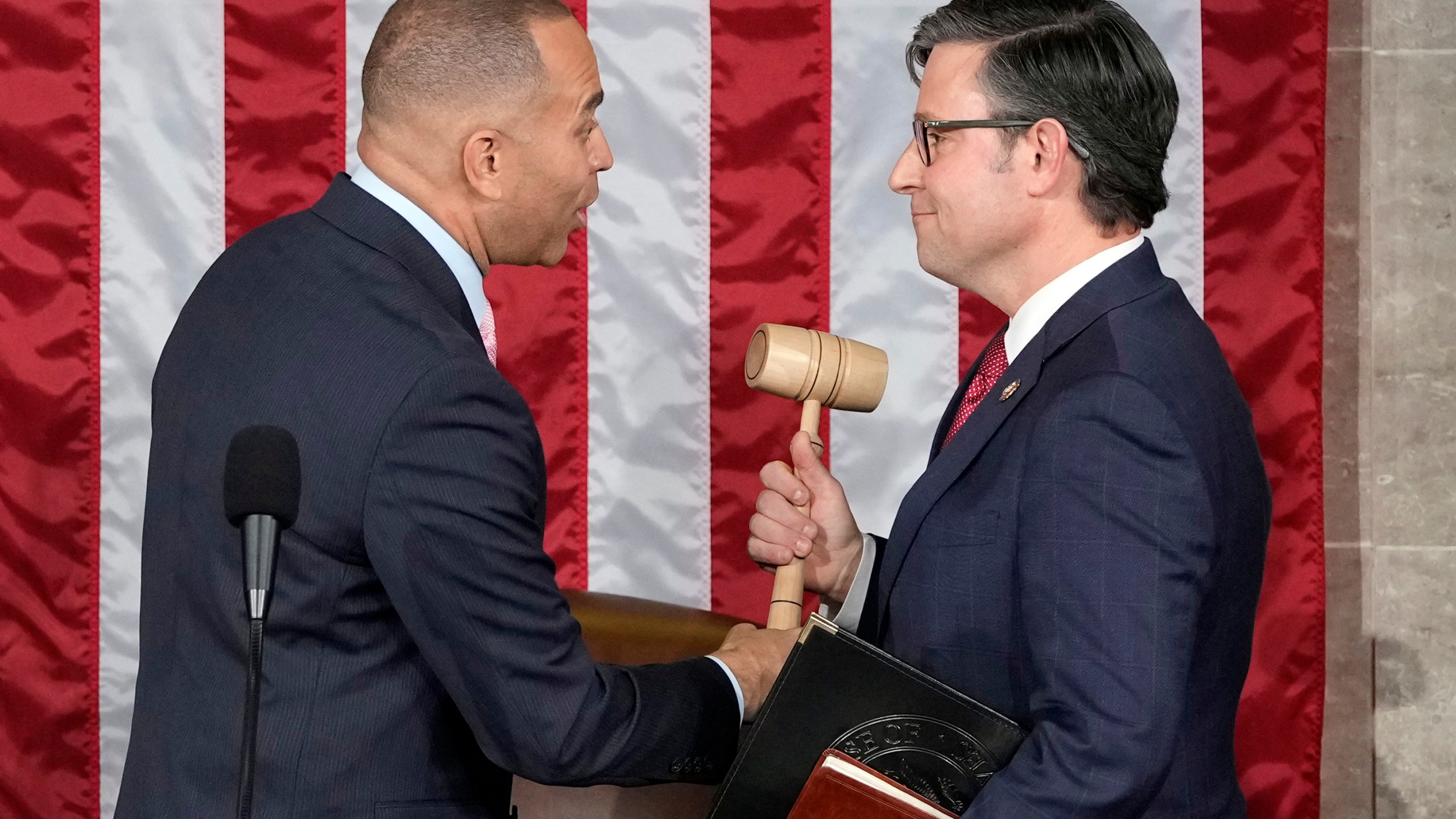 House Minority Leader Hakeem Jeffries of N.Y., hands the gavel to speaker-elect Rep. Mike Johnson, R-La., at the Capitol in Washington, Wednesday, Oct. 25, 2023. (AP Photo/Alex Brandon)