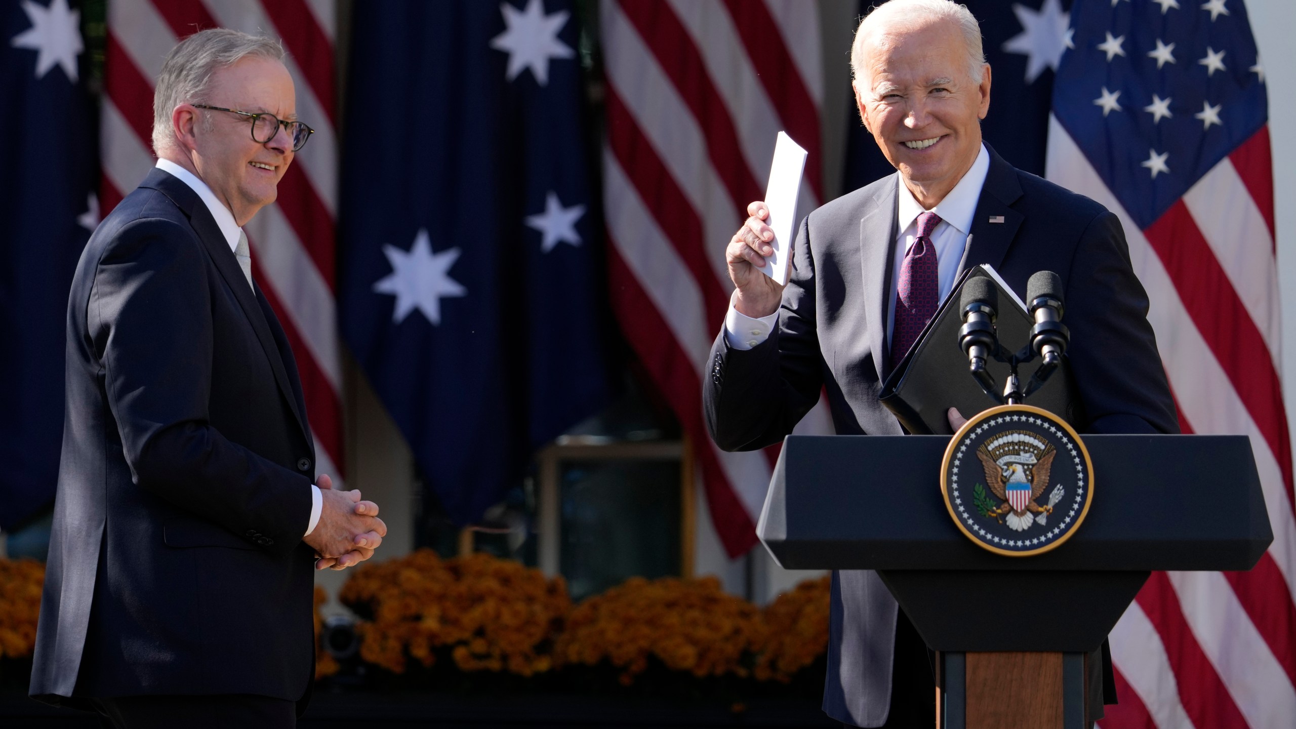 President Joe Biden and Australia's Prime Minister Anthony Albanese wrap up after speaking in the Rose Garden of the White House during a news conference in Washington, Wednesday, Oct. 25, 2023. (AP Photo/Manuel Balce Ceneta)