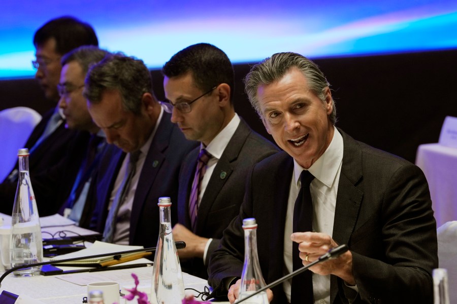 California Gov. Gavin Newsom, right, speaks during the Great Wall Climate Dialogue held at the Yanqi hotel on the outskirts of Beijing, Thursday, Oct. 26, 2023. Newsom is on a weeklong tour of China to push for climate cooperation. (AP Photo/Ng Han Guan)