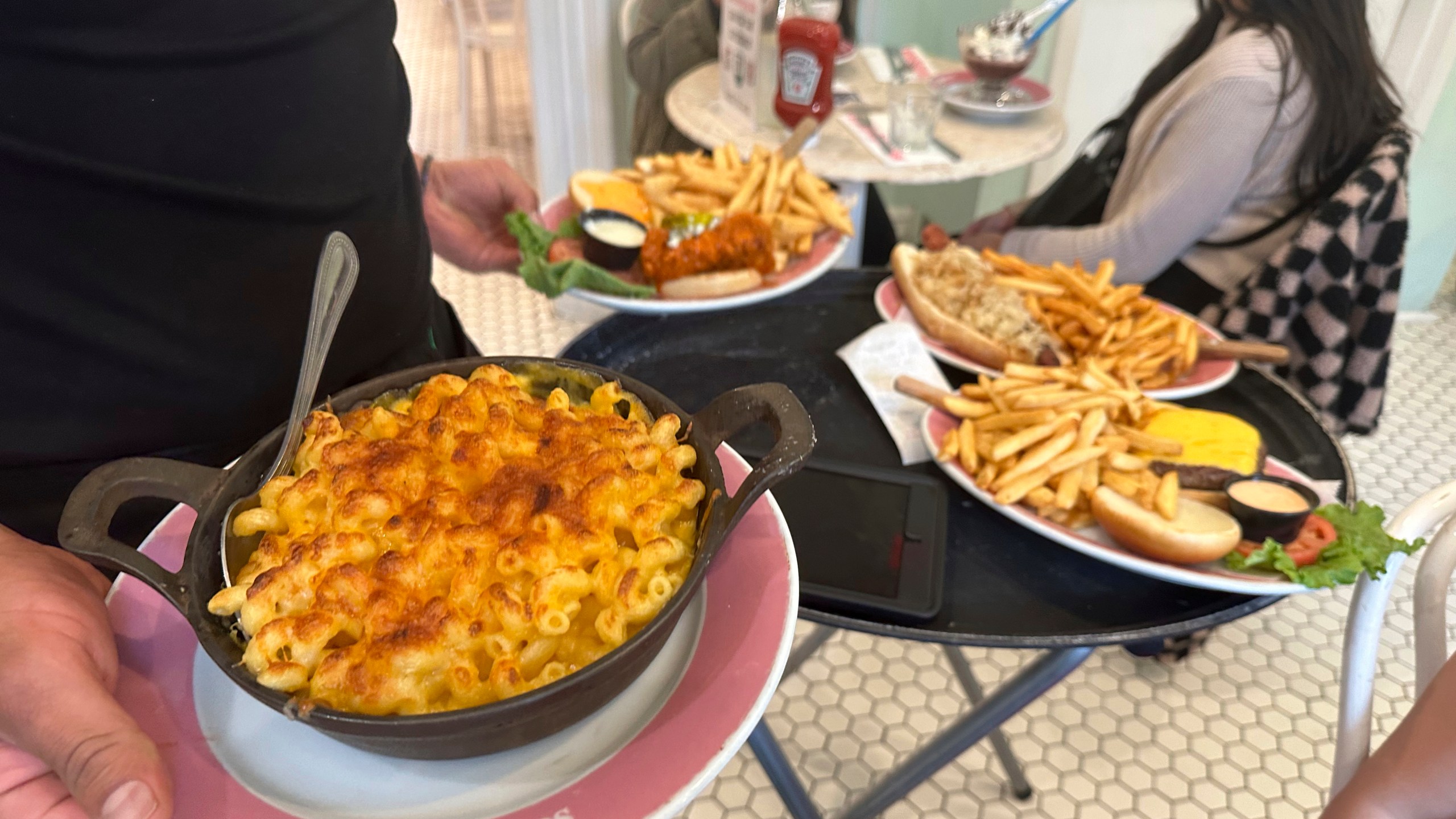 Food is served at Serendipity 3 restaurant in New York City on Sunday, October 8, 2023. On Thursday, the Commerce Department issues its first of three estimates of how the U.S. economy performed in the third quarter of 2023.(AP Photo/Ted Shaffrey)