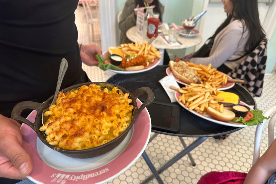 Food is served at Serendipity 3 restaurant in New York City on Sunday, October 8, 2023. On Thursday, the Commerce Department issues its first of three estimates of how the U.S. economy performed in the third quarter of 2023.(AP Photo/Ted Shaffrey)