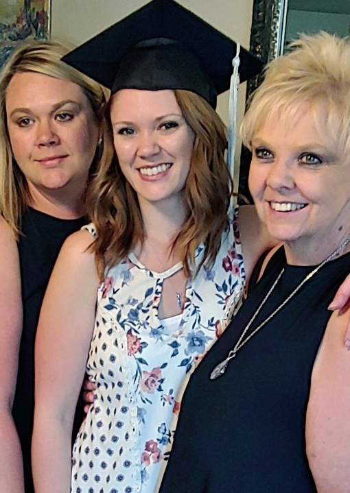 Brianna Hayes, center, poses with her older sister Darci Hayes, left, and mother Sharon Hayes, right, in June 2019 after graduating from her graduate school program at Eastern Washington University in Cheney, Wash. Sharon Hayes, of Hauser, Idaho, sued her former fertility doctor in Spokane on Wednesday, Oct. 25, 2023, saying that he secretly used his own sperm to inseminate her when she became pregnant with her second daughter 34 years ago – information Brianna Hayes said she discovered after taking an at-home DNA test. (Sharon Hayes via AP)