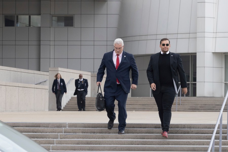 U.S. Rep. George Santos leaves the federal courthouse in Central Islip, N.Y., on Friday Oct. 27, 2023. Santos has pleaded not guilty to on a revised indictment accusing him of several frauds, including making tens of thousands of dollars in unauthorized charges on credit cards belonging to his campaign donors. (AP Photo/Stefan Jeremiah)