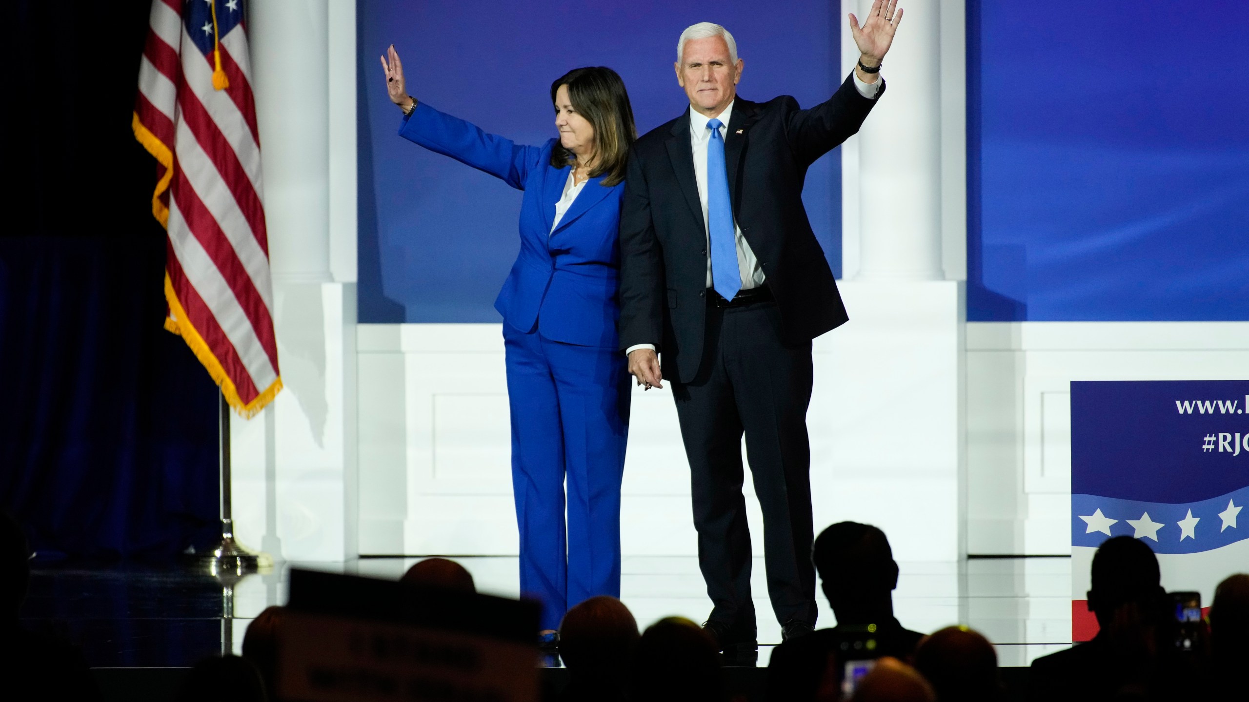 Karen Pence, left, and former Vice President Mike Pence wave to the crowd at an annual leadership meeting of the Republican Jewish Coalition, Saturday, Oct. 28, 2023, in Las Vegas. (AP Photo/John Locher)