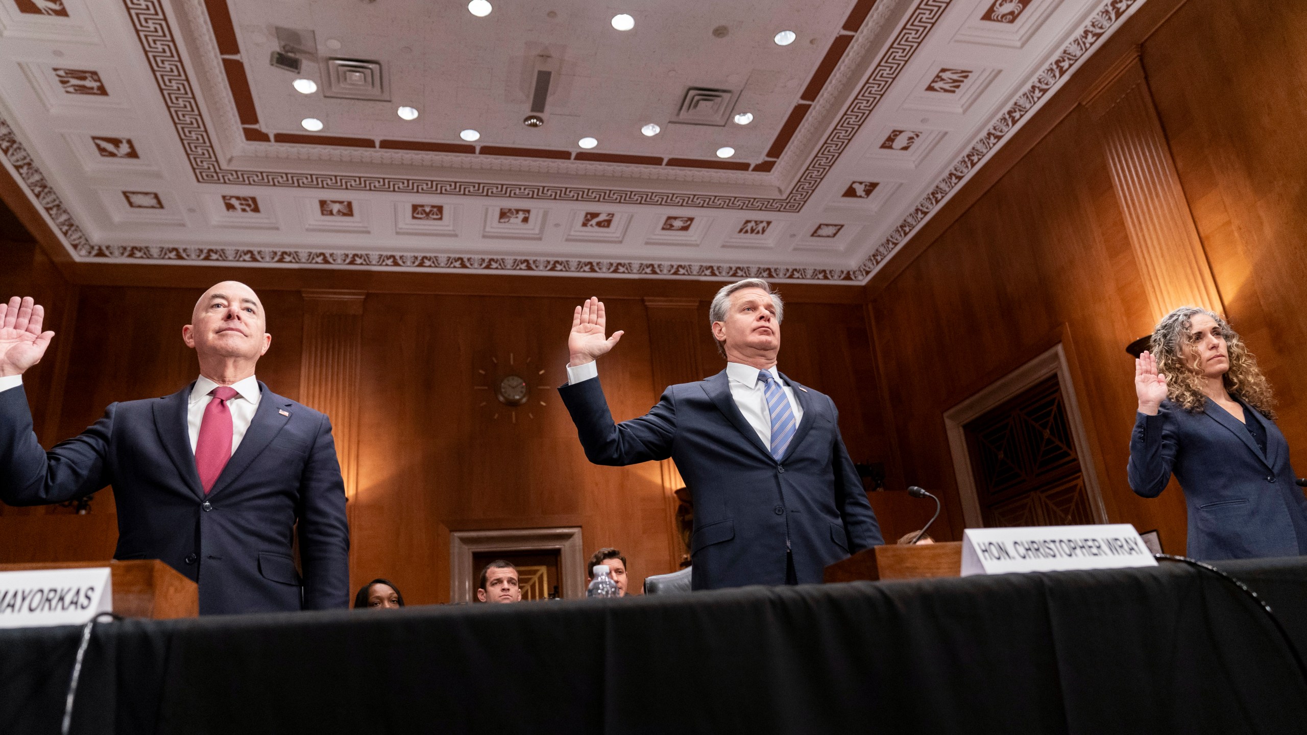 Secretary of Homeland Security Alejandro Mayorkas, FBI Director Christopher Wray and National Counterterrorism Center Office Director Christine Abizaid, from left, are sworn in before testifying during a Senate Homeland Security and Governmental Affairs Committee hearing on threats to the homeland, Tuesday, Oct. 31, 2023, on Capitol Hill in Washington. (AP Photo/Stephanie Scarbrough)