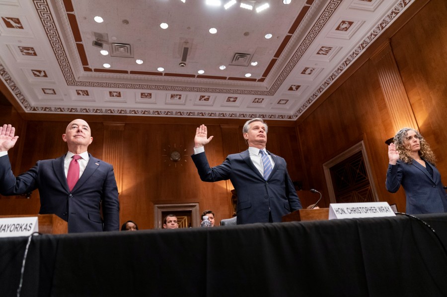 Secretary of Homeland Security Alejandro Mayorkas, FBI Director Christopher Wray and National Counterterrorism Center Office Director Christine Abizaid, from left, are sworn in before testifying during a Senate Homeland Security and Governmental Affairs Committee hearing on threats to the homeland, Tuesday, Oct. 31, 2023, on Capitol Hill in Washington. (AP Photo/Stephanie Scarbrough)