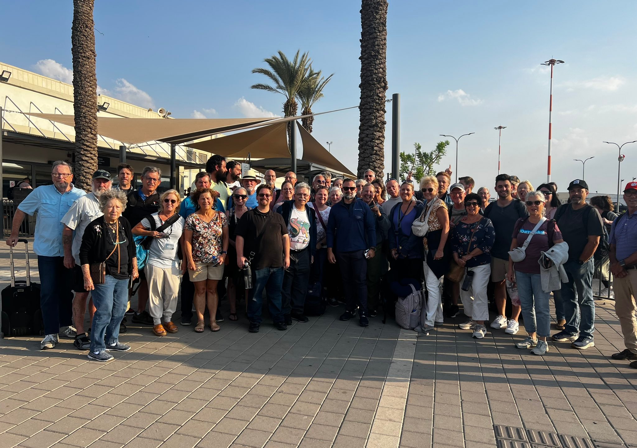 Rep. Cory Mills poses with Americans who he helped evacuate from Israel. (Rep. Cory Mills)