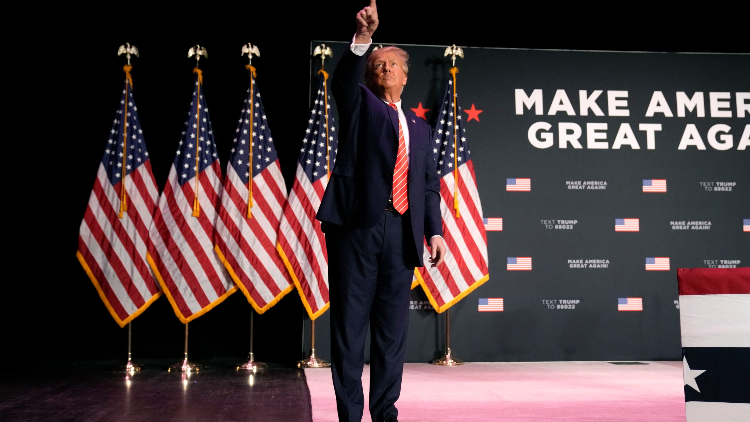 Former President Donald Trump walks off stage after a commit to caucus rally, Sunday, Oct. 29, 2023, in Sioux City, Iowa. (AP Photo/Charlie Neibergall)