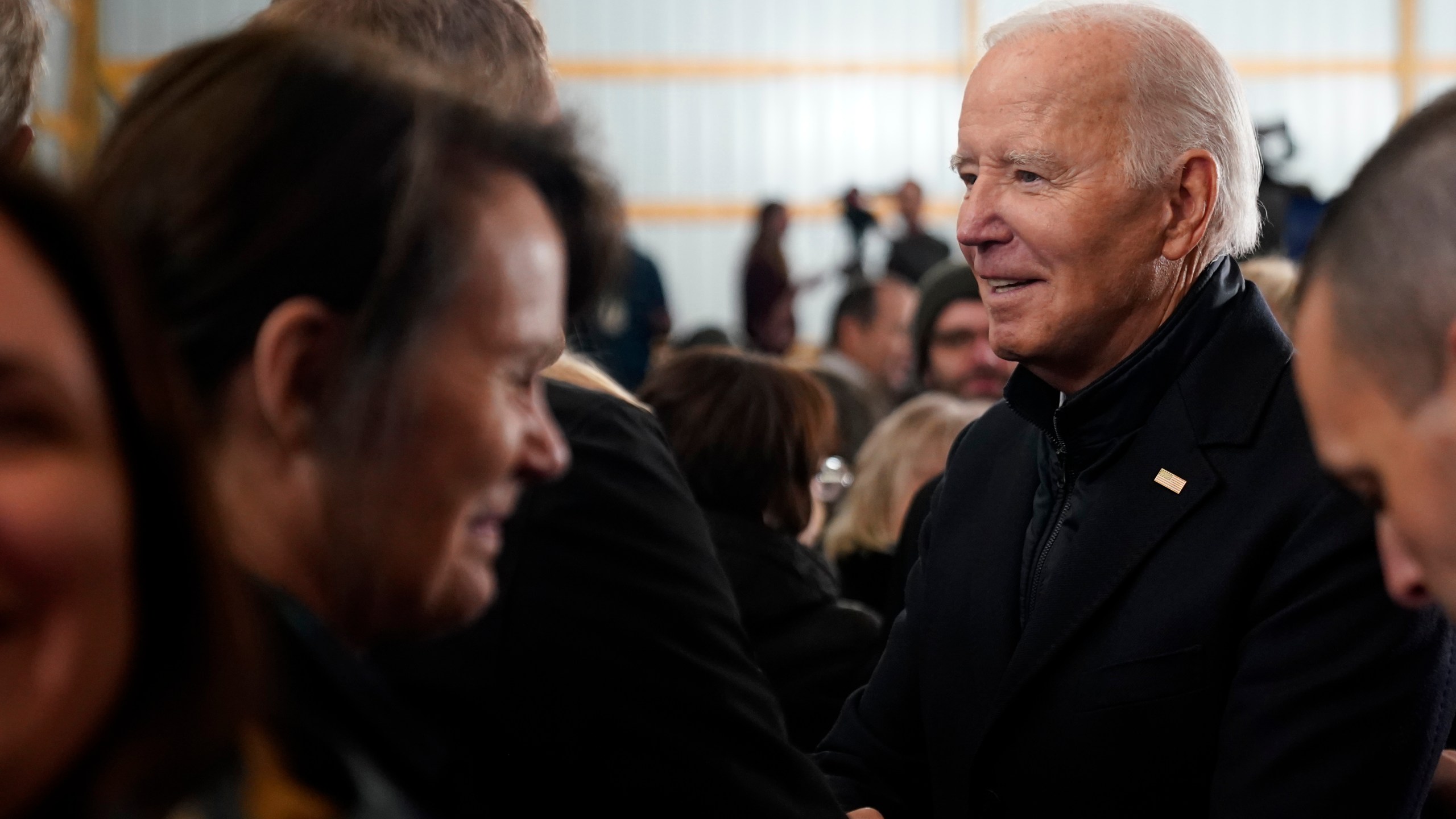 President Joe Biden talks with guests after speaking at Dutch Creek Farms in Northfield, Minn., Wednesday, Nov. 1, 2023. (AP Photo/Andrew Harnik)