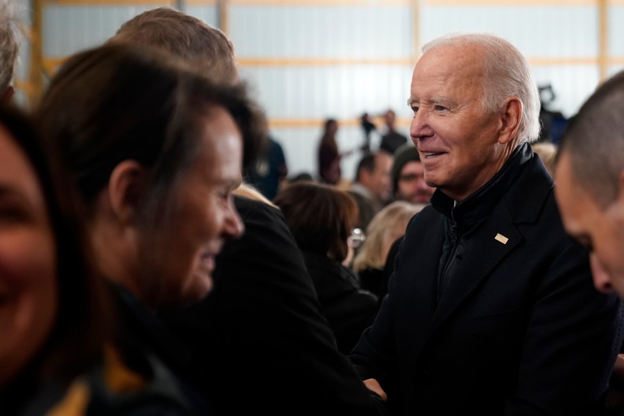 President Joe Biden talks with guests after speaking at Dutch Creek Farms in Northfield, Minn., Wednesday, Nov. 1, 2023. (AP Photo/Andrew Harnik)