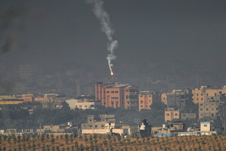 An Israeli army flare is seen over the northern part of the Gaza Strip, as seen from southern Israel, Wednesday, Nov. 1, 2023. (AP Photo/Ariel Schalit)