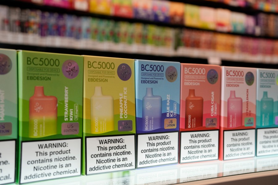 FILE - Varieties of disposable flavored electronic cigarette devices manufactured by EB Design, formerly known as Elf Bar, are displayed at a store in Pinecrest, Fla., Monday, June 26, 2023. A report released by the Centers for Disease Control and Prevention on Thursday, Nov. 2, 2023, shows fewer high school students are vaping. About 10% of high school students said they used electronic cigarettes in the previous month, down from 14% from the same survey conducted last year. Fewer high schools students also smoked cigarettes and cigars. The use of e-cigarettes among middle school students was about the same as last year. (AP Photo/Rebecca Blackwell, File)