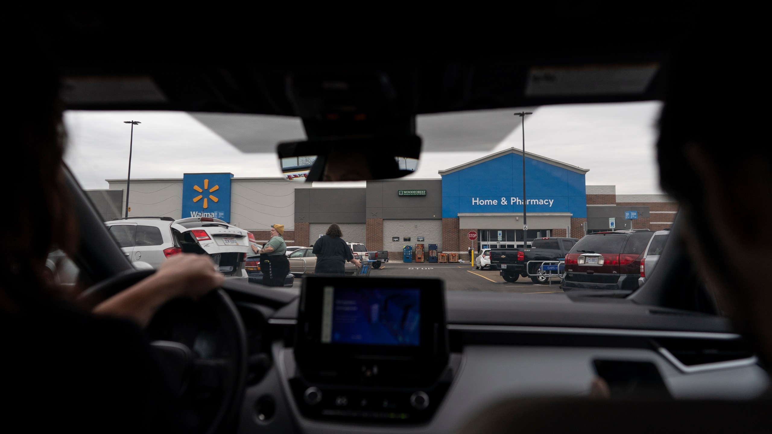 Jesse Johnson of the Family Resource Center drives a client to Walmart in Findlay, Ohio, Thursday, Oct. 12, 2023. Advocates in Hancock County say that transportation can be especially challenging for people in recovery, in part because they don't want to ask drug dealers for rides. (AP Photo/Carolyn Kaster)