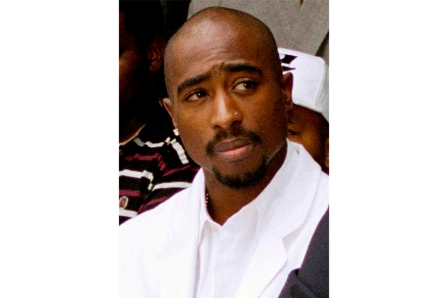 FILE - Rapper Tupac Shakur attends a voter registration event in South Central Los Angeles, Aug. 15, 1996. Duane Keith “Keffe D” Davis, a former Southern California street gang leader, pleaded not guilty Thursday, Nov. 2, 2023, to orchestrating a drive-by shooting that killed Shakur in 1996 in Las Vegas. (AP Photo/Frank Wiese, File)