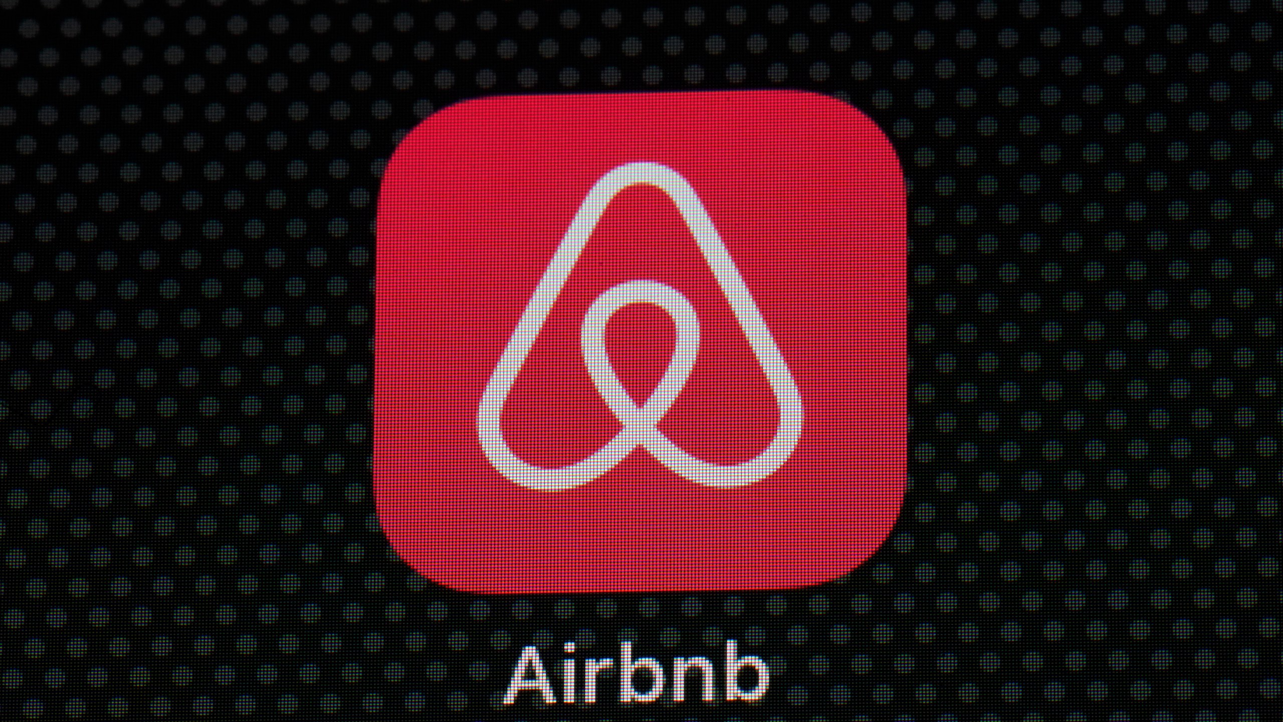 FILE - The Airbnb app icon is displayed on an iPad screen in Washington, D.C., on May 8, 2021. Airbnb reports earnings on Wednesday, Nov. 1, 2023. (AP Photo/Patrick Semansky, File)