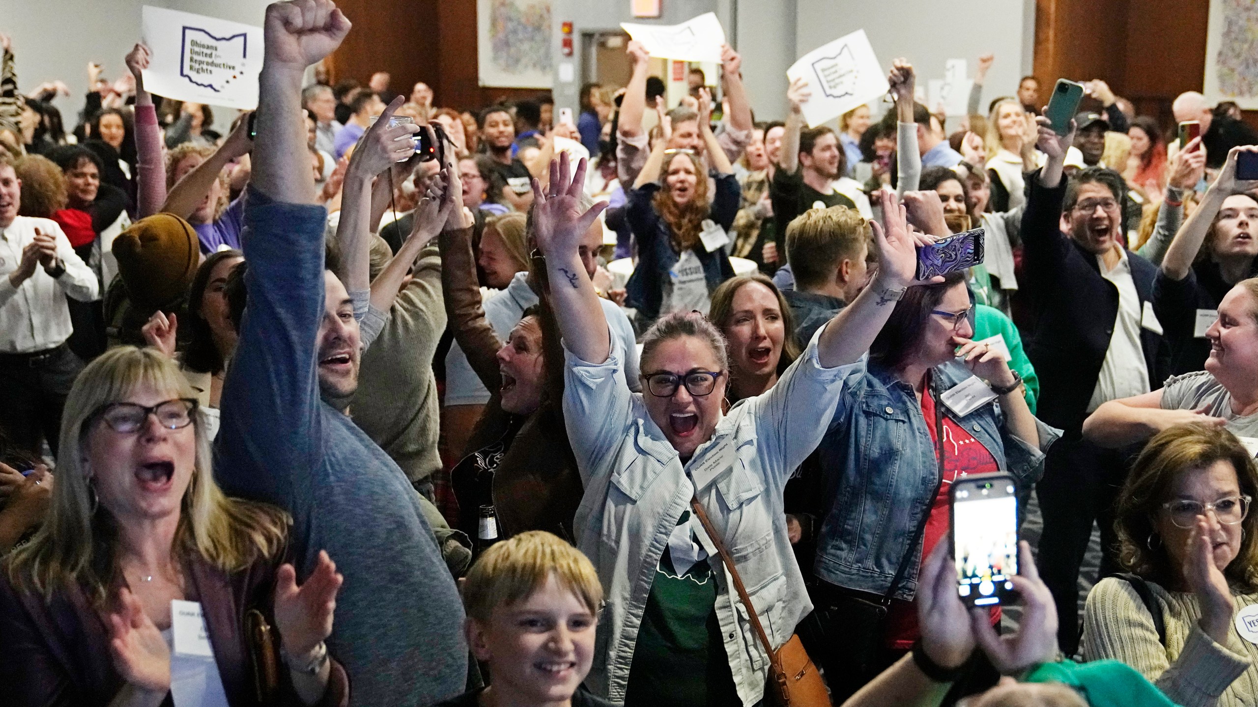 Issue 1 supporters cheer as they watch election results come in, Tuesday, Nov. 7, 2023, in Columbus Ohio. Ohio voters have approved a constitutional amendment that guarantees the right to abortion and other forms of reproductive health care. The outcome of Tuesday’s intense, off-year election was the latest blow for abortion opponents. (AP Photo/Sue Ogrocki)