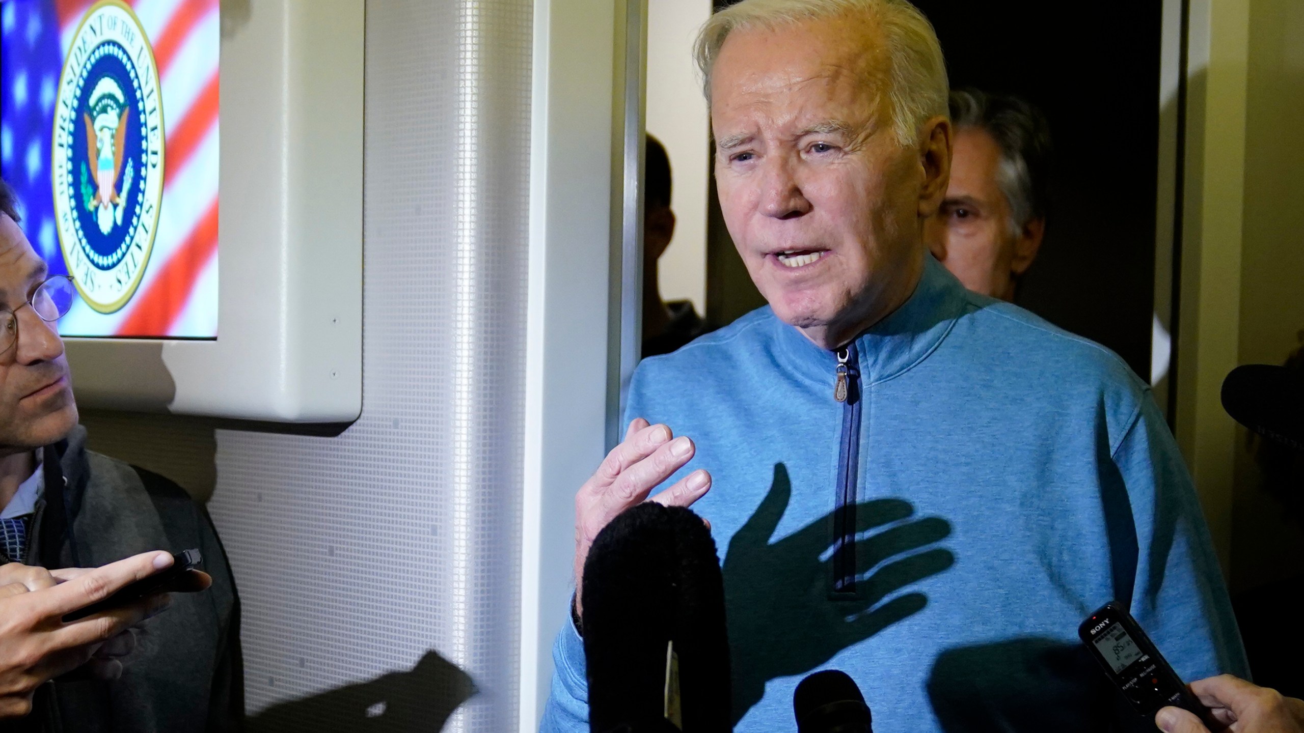 FILE - President Joe Biden talks to reporters aboard Air Force One during a refueling stop in at Ramstein Air Base in Germany, Oct. 18, 2023, as he travels back from Israel to Washington. Nearly half of Democrats disapprove of how Biden is handling the Israel-Hamas conflict, according to a new Associated Press-NORC Center for Public Affairs Research poll. The war could complicate Biden's reelection effort as he tries to balance factions of his party with very different views on the conflict. (AP Photo/Evan Vucci)