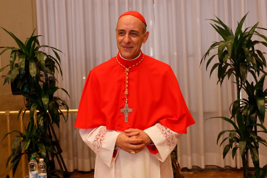 FILE - Cardinal Víctor Manuel Fernández, Prefect of the Dicastery for the Doctrine of the Faith, poses for a photo, Sept. 30, 2023, in St. Peter's Square at the Vatican. In the United States, the national conference of Catholic bishops rejects the concept of gender transition. On Wednesday, Nov. 8, the Vatican made public a sharply contrasting statement, saying it’s permissible, under certain circumstances, for trans Catholics to be baptized and serve as godparents. The document was signed Oct. 21 by Pope Francis and Fernández. (AP Photo/Riccardo De Luca, File)