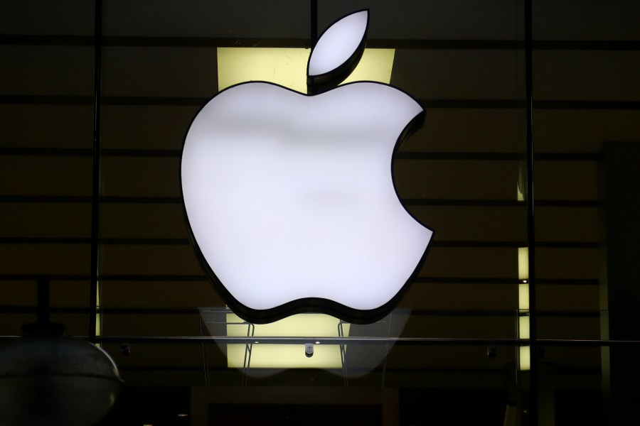 FILE - The Apple logo is illuminated at a store in the city center of Munich, Germany, Dec. 16, 2020. Apple might end up on the hook after all for billions of euros in back taxes to Ireland in the latest twist in a longrunning European Union dispute. That's after a legal opinion Thursday, Nov. 9, 2023 from an adviser to the bloc’s top court. (AP Photo/Matthias Schrader, File)