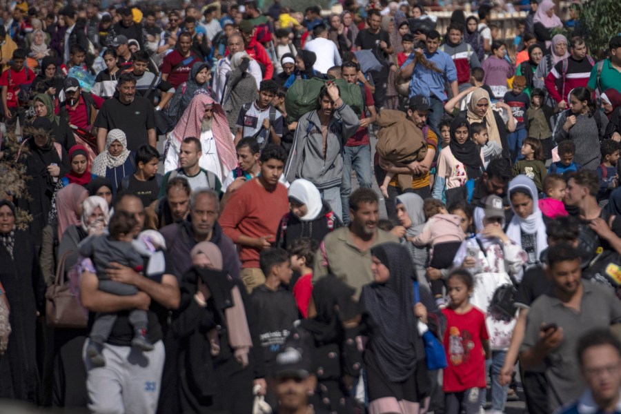 Palestinians flee to the southern Gaza Strip on Salah al-Din Street in Bureij, Gaza Strip, Friday, Nov. 10, 2023. (AP Photo/Fatima Shbair)