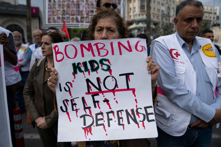 Members of the Palestinian health sector take part in a rally to protest the collapse of the Palestinian health services in Gaza, in the West Bank city of Ramallah, Sunday, Nov. 12, 2023. Israeli strikes pounded Gaza City overnight and into Sunday as ground forces battled Hamas militants near the territory's largest hospital, where health officials say thousands of medics, patients and displaced people are trapped with no electricity and dwindling supplies. (AP Photo/Nasser Nasser)