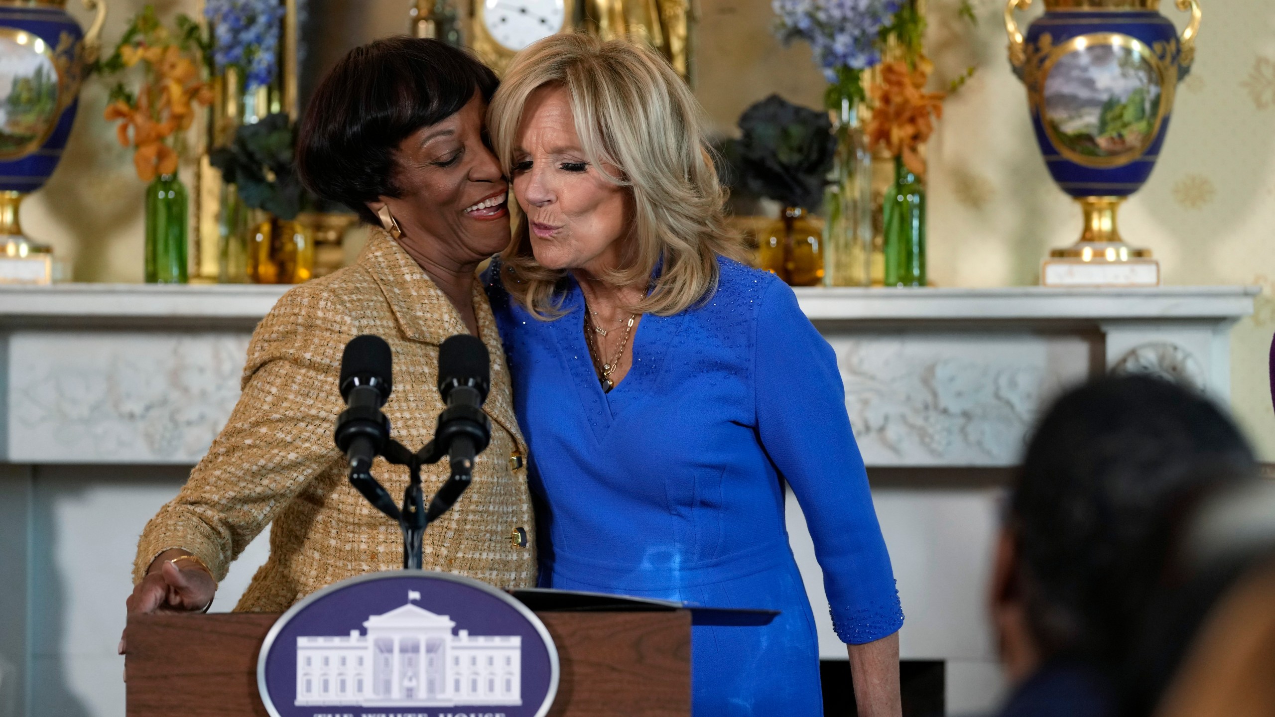 First lady Jill Biden, right, gets a hug and a kiss from Robin Jackson, left, wife of Charles Jackson, pastor of Brookland Baptist Church in West Columbia, S.C., during a celebration of the Thanksgiving season with African American women faith leaders, community leaders and advocates from the Southeast, in the Blue Room of the White House in Washington, Monday, Nov. 13, 2023. (AP Photo/Susan Walsh)