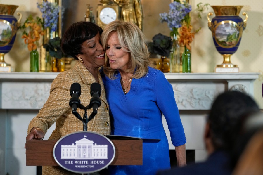 First lady Jill Biden, right, gets a hug and a kiss from Robin Jackson, left, wife of Charles Jackson, pastor of Brookland Baptist Church in West Columbia, S.C., during a celebration of the Thanksgiving season with African American women faith leaders, community leaders and advocates from the Southeast, in the Blue Room of the White House in Washington, Monday, Nov. 13, 2023. (AP Photo/Susan Walsh)