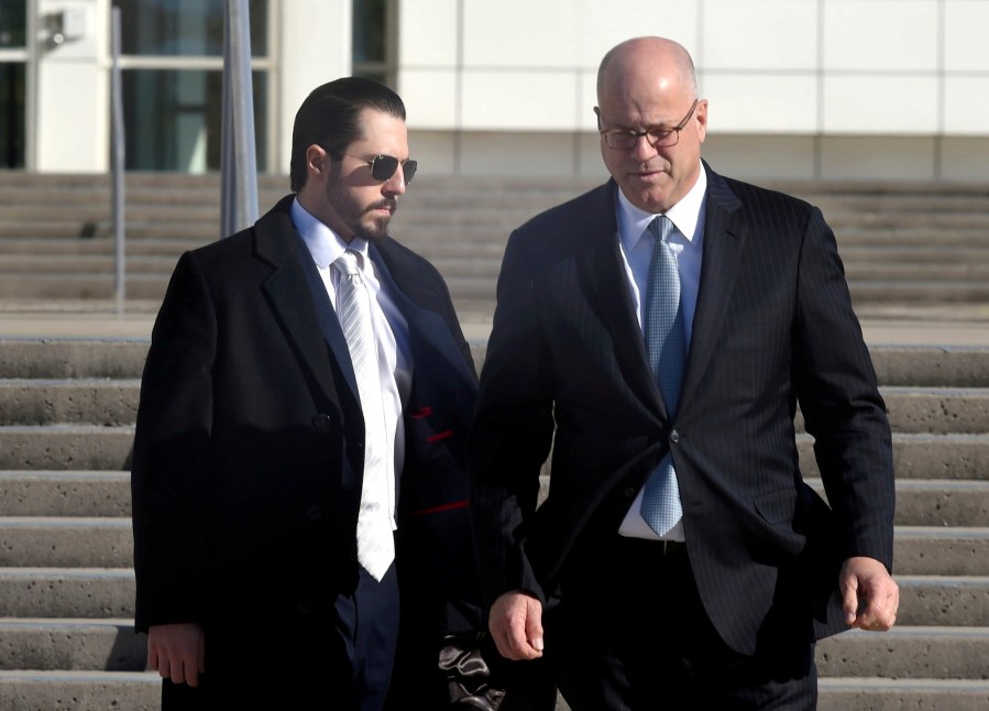 Samuel Miele, left, leaves Federal Court in Central Islip, N.Y., with his lawyer, Kevin Marino, on Tuesday, Nov 14, 2023. Miele, a former fundraiser for U.S. Rep. George Santos, pleaded guilty to a federal wire fraud charge. (John Roca/Newsday via AP)