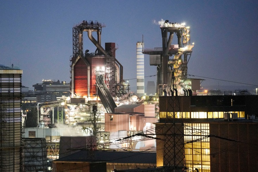 A blast furnace of German steel producer thyssenkrupp Steel Europe is in operation in the late evening in Duisburg, Germany, Wednesday, Oct. 11, 2023. The world is off track in its efforts to curb global warming, a new international report calculates Tuesday, Nov. 14. (AP Photo/Martin Meissner)