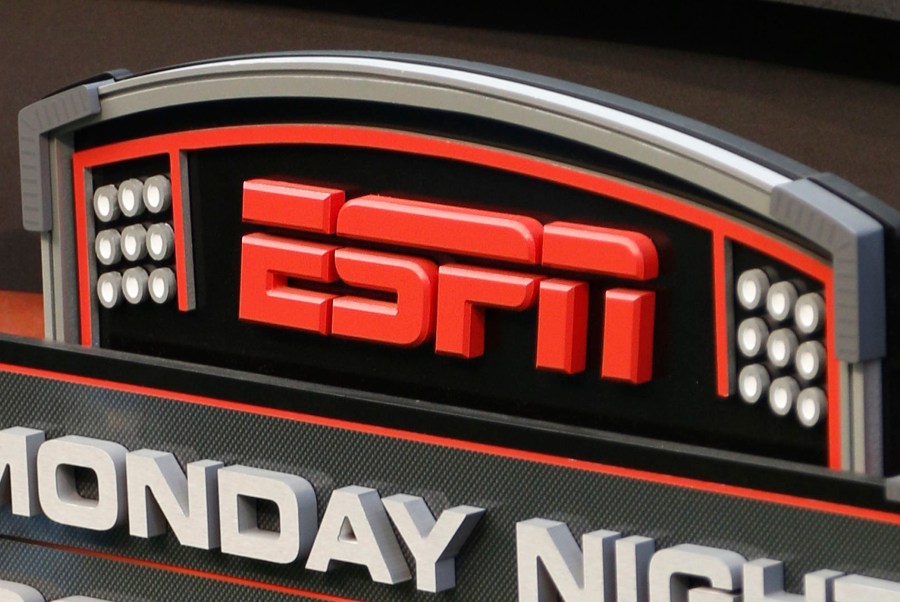 FILE - The ESPN logo is seen, Sept. 16, 2013, prior to an NFL football game between the Cincinnati Bengals and the Pittsburgh Steelers in Cincinnati. ESPN Bet, a rebranded sports-gambling app owned by Penn Entertainment, is set to launch Tuesday, Nov. 14, 2023. (AP Photo/David Kohl, File)