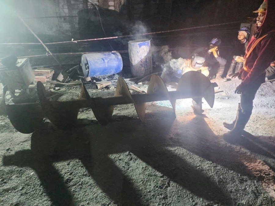 This photo provided by Uttarakhand State Disaster Response Force (SDRF) shows rescuers and others inside a collapsed road tunnel where 40 workers were trapped in northern in Uttarakhand state, India, Tuesday, Nov.14, 2023. ( SDRF via AP)