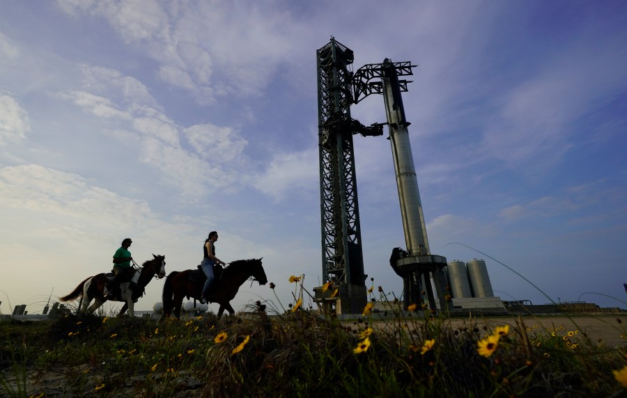 FILE - NASA astronaut Sunita Williams, left, and Haley Esparza ride on horses as they visit SpaceX's Starship, April 19, 2023, as it's readied for launch at Starbase in Boca Chica, Texas. SpaceX is aiming for another test flight of its mega rocket, Starship, on Friday, Nov. 17, after getting the final OK from the Federal Aviation Administration. The FAA issued its license Wednesday, Nov. 15, noting that SpaceX has met safety, environmental and other requirements. (AP Photo/Eric Gay, File)