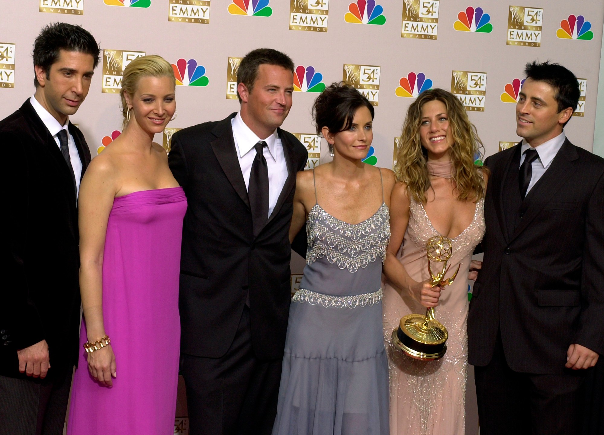 FILE - David Schwimmer, from left, Lisa Kudrow, Matthew Perry, Courteney Cox, Jennifer Aniston and Matt LeBlanc pose after "Friends" won outstanding comedy series at the 54th Primetime Emmy Awards on Sept. 22, 2002, in Los Angeles. Cast members are sharing more remembrances of Perry in their first personal social media posts since the actor’s death on Oct. 28. (AP Photo/Reed Saxon, File)