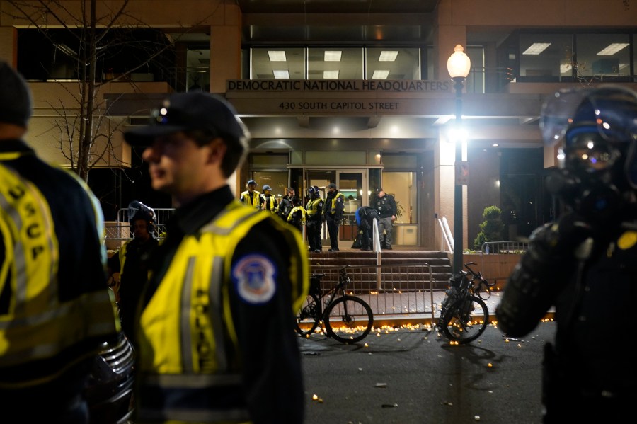 U.S. Capitol Police stand outside the headquarters of the Democratic National Committee Wednesday, Nov. 15, 2023, in Washington.(AP Photo/Nathan Howard)