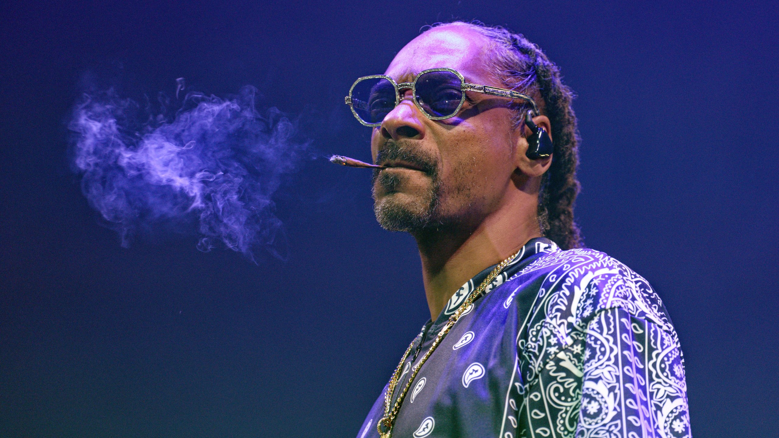 FILE - Rapper Snoop Dogg performs during a concert at Lanxess Arena, Thursday, Sept. 21, 2023, in Cologne, Germany. Asking for privacy, hip-hop legend and longtime marijuana enthusiast Snoop Dogg says he's going to stop smoking — though he didn't specify exactly what that might mean. "After much consideration and conversation with my family, I've decided to give up smoke," Snoop wrote in a message shared on Instagram and X, the platform formerly known as Twitter, on Thursday, Nov. 16. (Henning Kaiser/dpa via AP, File)