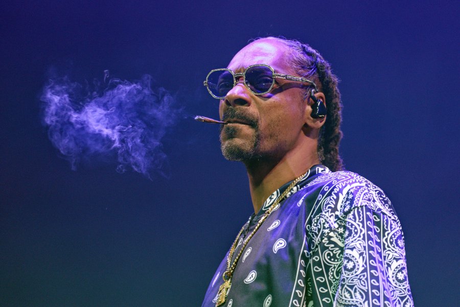 FILE - Rapper Snoop Dogg performs during a concert at Lanxess Arena, Thursday, Sept. 21, 2023, in Cologne, Germany. Asking for privacy, hip-hop legend and longtime marijuana enthusiast Snoop Dogg says he's going to stop smoking — though he didn't specify exactly what that might mean. "After much consideration and conversation with my family, I've decided to give up smoke," Snoop wrote in a message shared on Instagram and X, the platform formerly known as Twitter, on Thursday, Nov. 16. (Henning Kaiser/dpa via AP, File)