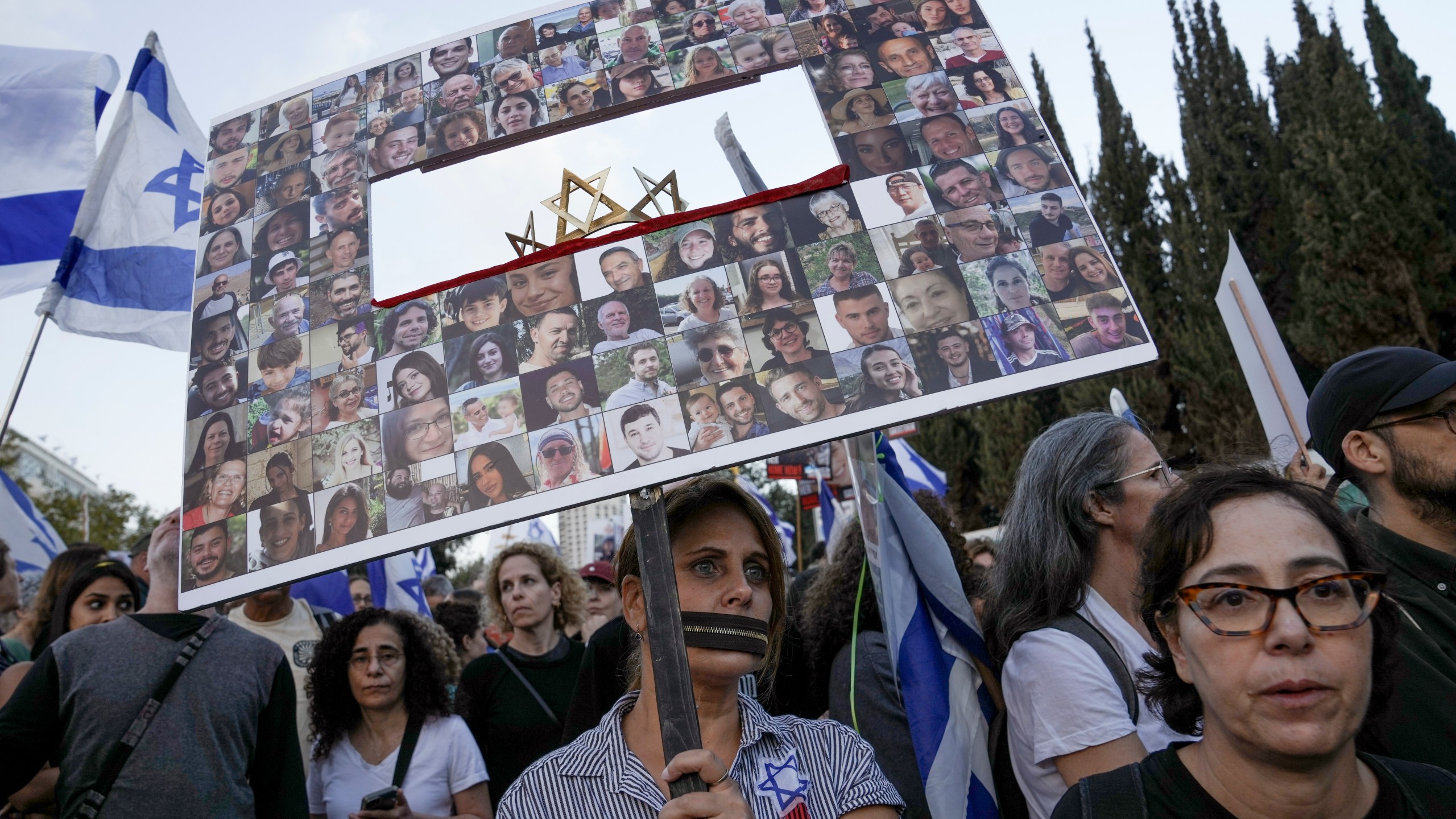 Family and supporters of the estimated 240 hostages held by Hamas in Gaza complete the final leg of a five-day solidarity rally calling for their return, from Tel Aviv to the Prime Minister's office in Jerusalem, Saturday, Nov. 18, 2023. The hostages, mostly Israeli citizens, were abducted during the brutal Oct. 7 Hamas cross-border attack in Israel and have been held in the enclave since as war rages. (AP Photo/Mahmoud Illean)