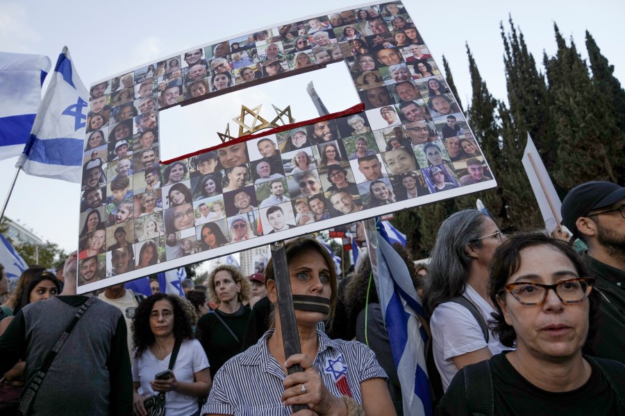 Family and supporters of the estimated 240 hostages held by Hamas in Gaza complete the final leg of a five-day solidarity rally calling for their return, from Tel Aviv to the Prime Minister's office in Jerusalem, Saturday, Nov. 18, 2023. The hostages, mostly Israeli citizens, were abducted during the brutal Oct. 7 Hamas cross-border attack in Israel and have been held in the enclave since as war rages. (AP Photo/Mahmoud Illean)