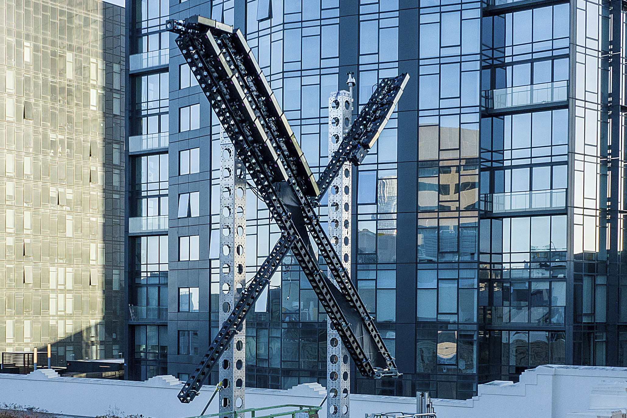 File - An "X" sign sits atop the social media platform's headquarters, in San Francisco, on July 28, 2023. IBM has stopped advertising on X after a report said its ads were appearing alongside material praising Adolf Hitler and Nazis. (AP Photo/Noah Berger, File)