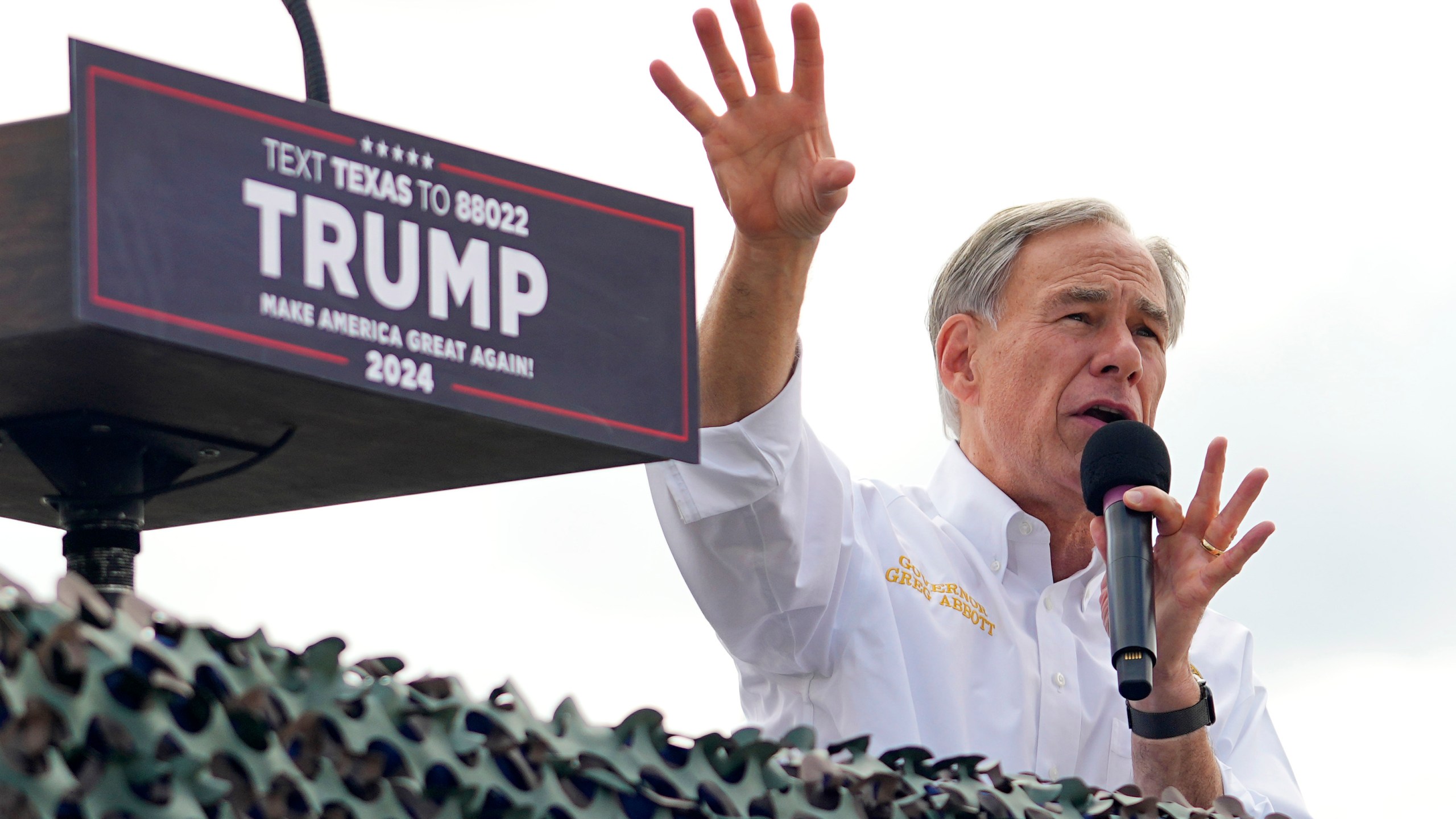 Texas Gov. Greg Abbott endorses Republican presidential candidate and former President Donald Trump during an event at the South Texas International Airport Sunday, Nov. 19, 2023, in Edinburg, Texas. (AP Photo/Eric Gay)