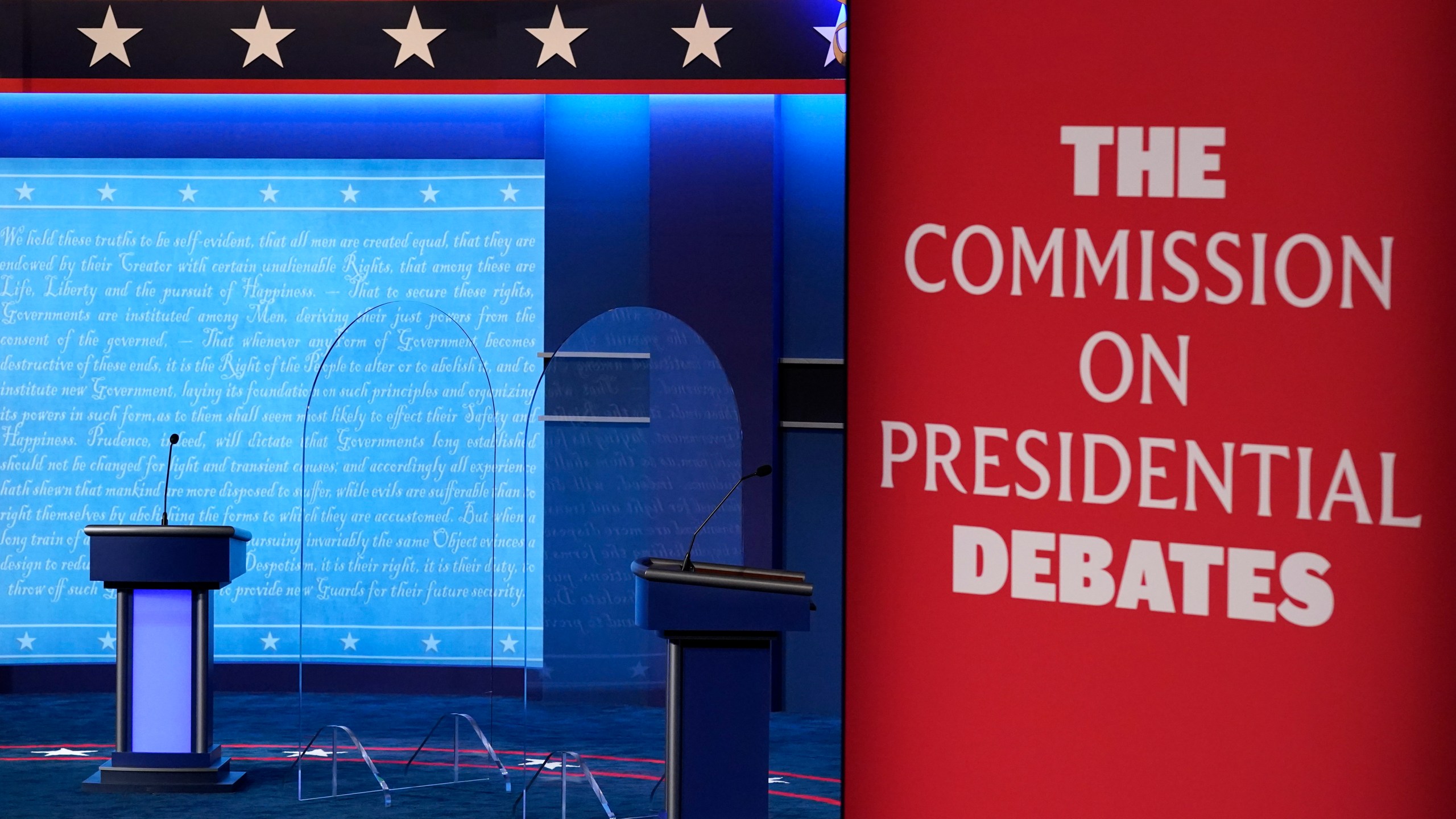 FILE - Clear protective panels stand onstage between lecterns as preparations take place for the second Presidential debate at Belmont University, Oct. 21, 2020, in Nashville, Tenn. Three debates for next year's presidential general election are set to be held in college towns in Texas, Virginia and Utah between Sept. 16 and Oct. 9, with the lone vice presidential debate happening in-between in Pennsylvania — though whether the Republican nominee will participate remains to be seen. The nonpartisan Commission on Presidential Debates announced Monday, Nov. 20, 2023, that presidential candidates will first be scheduled to meet Sept. 16. (AP Photo/Patrick Semansky, File)